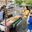 a group of people standing near a street food cart