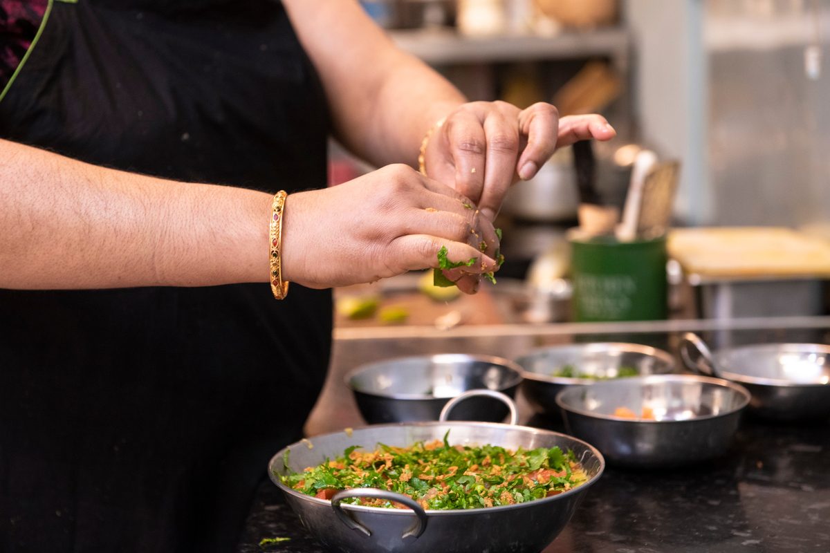 Hands of a woman cooking