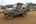 a military jeep parked on dirt