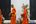 a group of people in orange robes