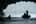 a group of people in a boat in a cave