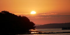 a sunset over a body of water