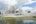 a white building with a body of water