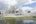 a white building with a body of water