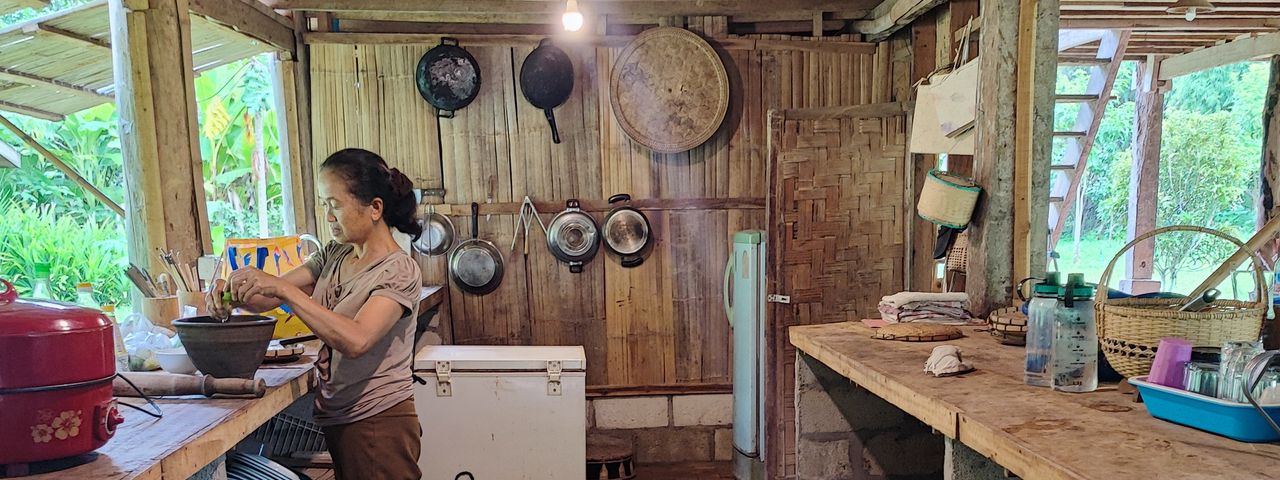 Woman preparing food in Nam Ou River homestay