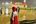 a person in a red and white cape