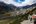 a couple of people hiking in a valley