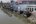 a group of people standing near a river