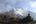 a mountain range with clouds and rocks