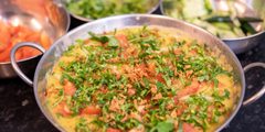 a bowl of food with vegetables in it