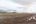a landscape with snow covered mountains