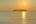a body of water with a small island in the distance