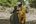 a man and woman holding a black bag