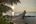 a wooden dock on a beach
