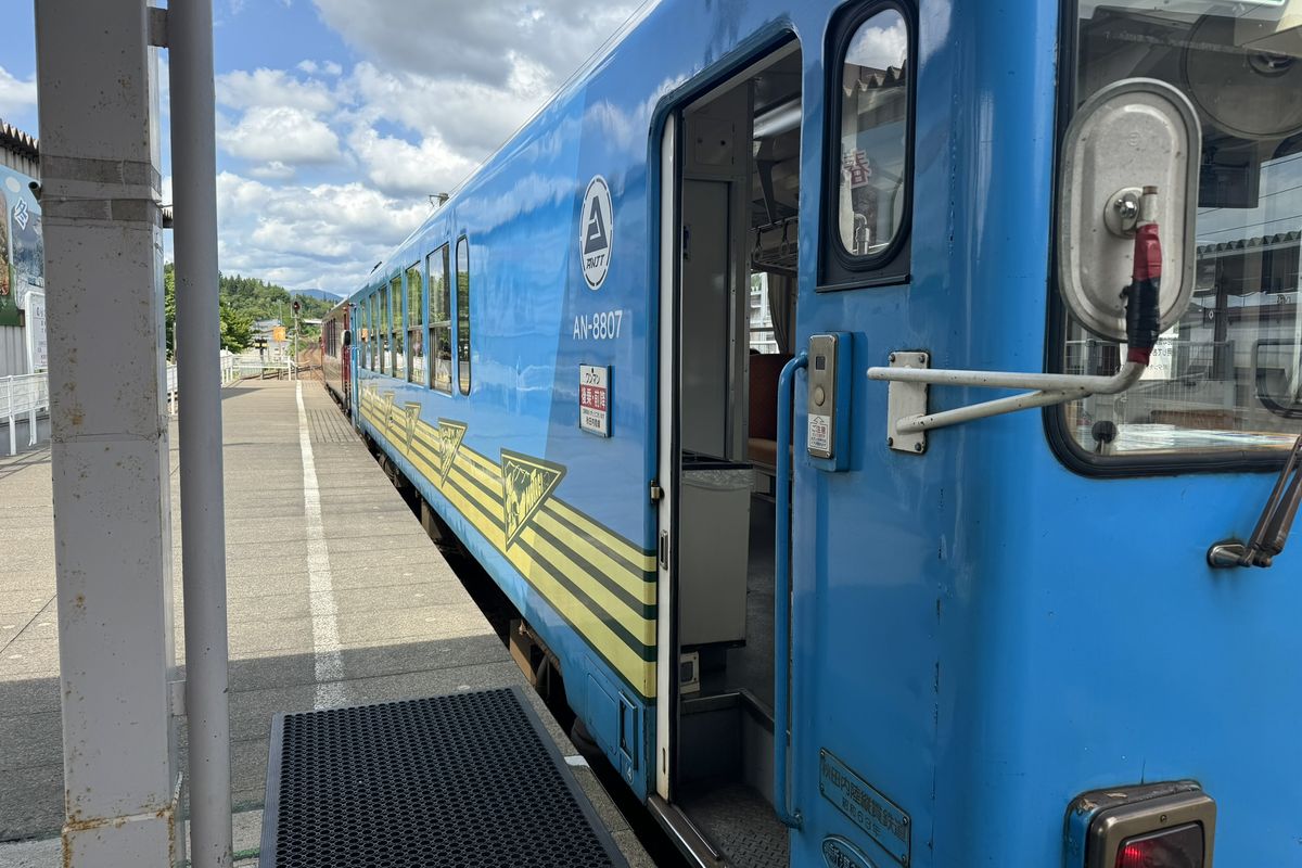 Train at a station in rural Japan