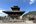 a building with a pagoda and statues