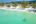Paddle boarding on turquoise sea at Royal Sands