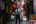 a man walking down a narrow alley