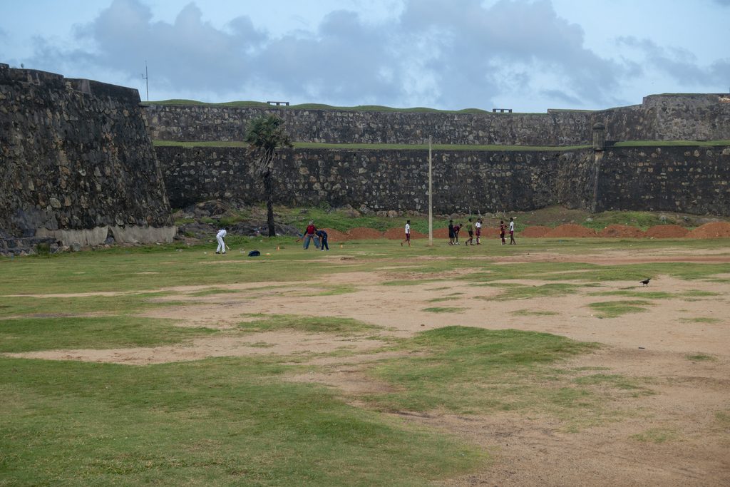 Group playing cricket in Galle, Sri Lanka