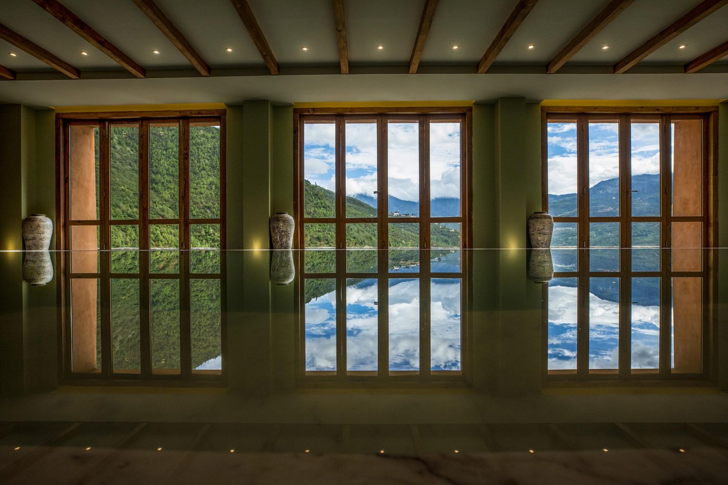 Swimming pool overlooking mountains at Bhutan Spirit Sanctuary