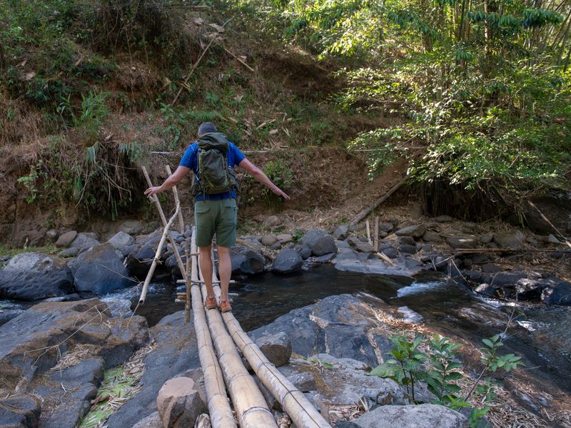 crossing a river in the maliau basin