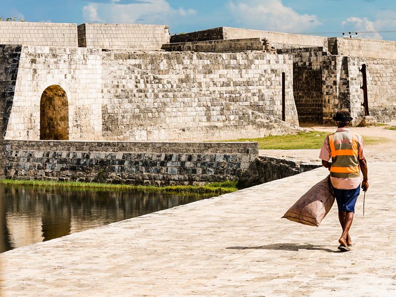 Man walking in front of Jaffna fort