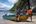 a group of men on a boat on a beach