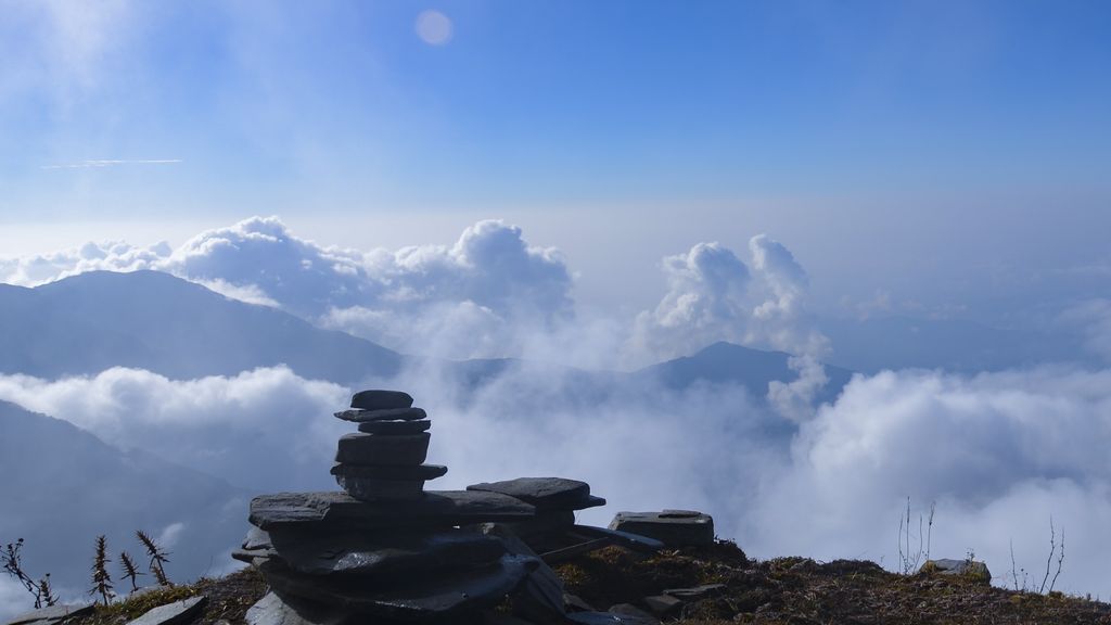 Stone stack looking out over the clouds